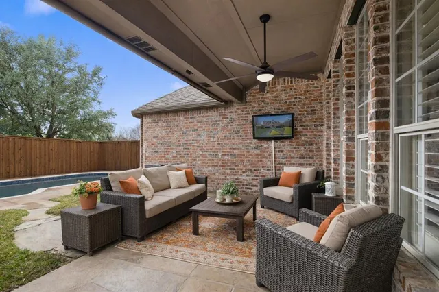a outdoor living space with furniture and a fireplace