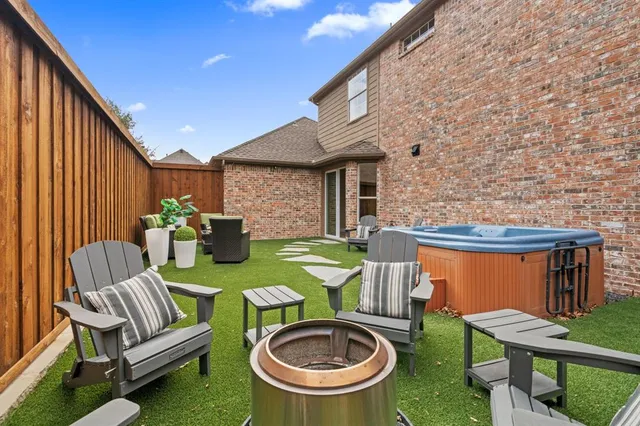 a view of a patio with couches table and chairs and potted plants with sky view