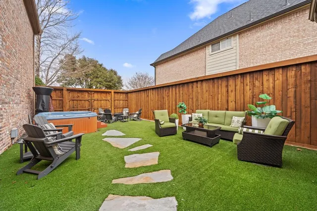 a view of a couches in patio of back yard