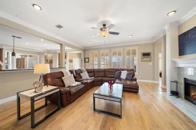 a living room with furniture fireplace and flat screen tv