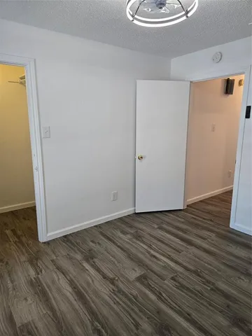 a view of a yard with large trees