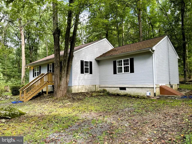 a house view with a backyard space
