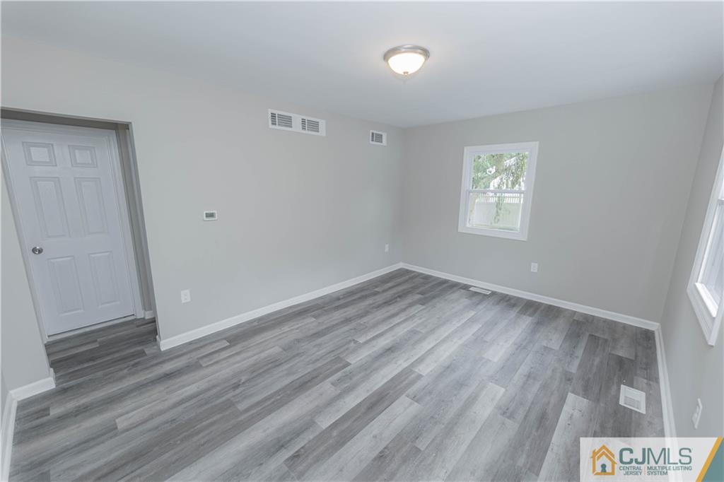 7 North Shore Boulevard Helmetta, NJ 08828 - Photo 11 of 50 an empty room with wooden floor and window