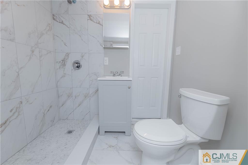 7 North Shore Boulevard Helmetta, NJ 08828 - Photo 14 of 50 a white toilet sitting next to a bath tub