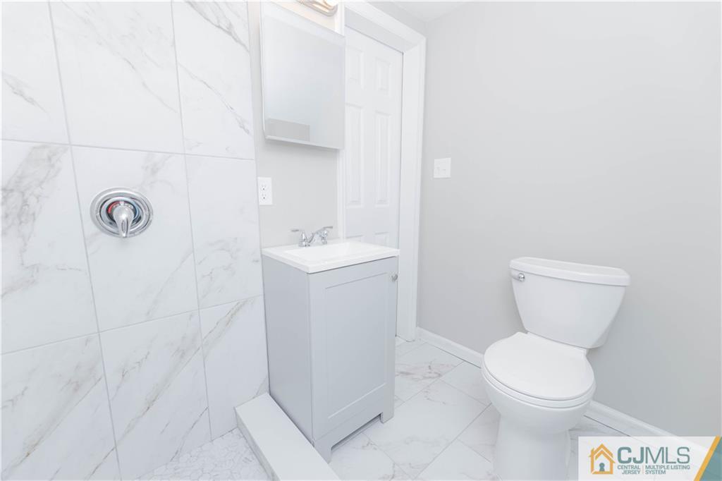 7 North Shore Boulevard Helmetta, NJ 08828 - Photo 15 of 50 a white toilet sitting next to a white sink