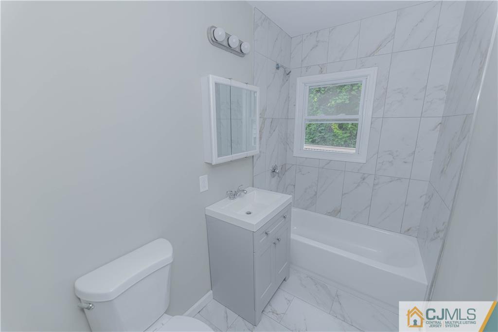 7 North Shore Boulevard Helmetta, NJ 08828 - Photo 17 of 50 a bathroom with a sink a toilet and shower