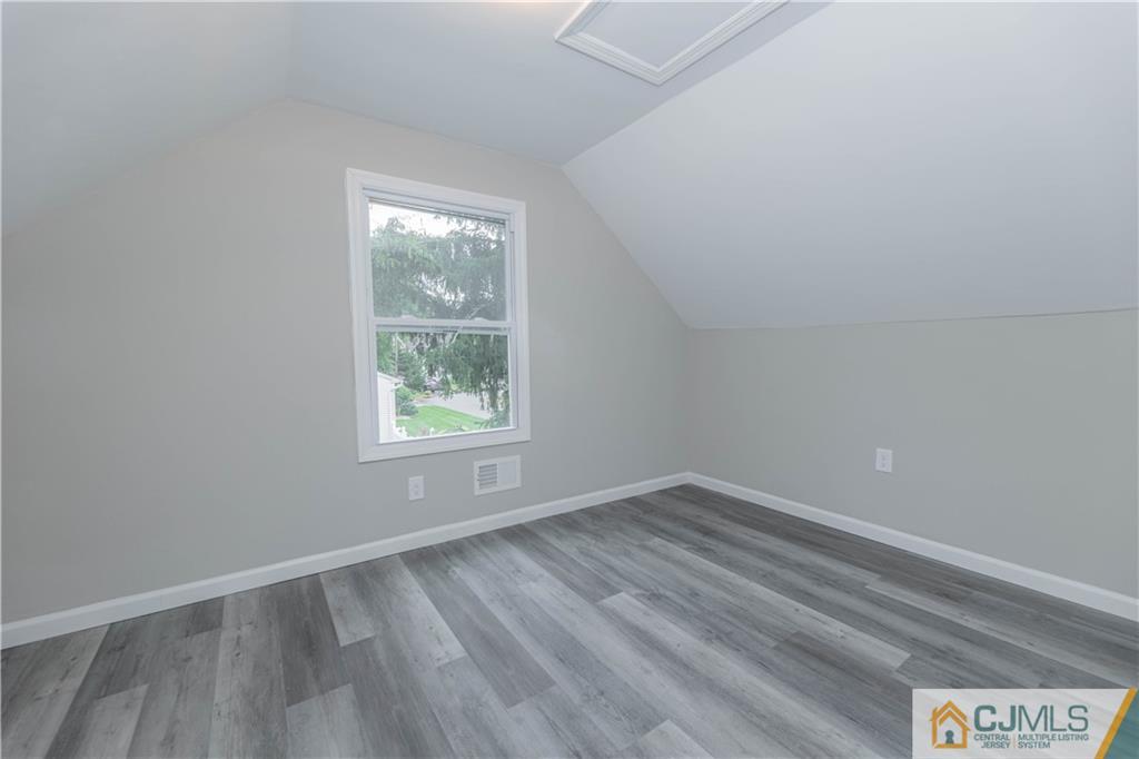 7 North Shore Boulevard Helmetta, NJ 08828 - Photo 20 of 50 a view of an empty room with wooden floor and a window