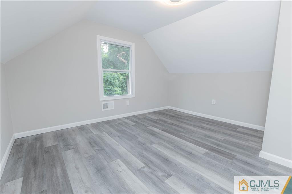 7 North Shore Boulevard Helmetta, NJ 08828 - Photo 21 of 50 wooden floor in an empty room with a window