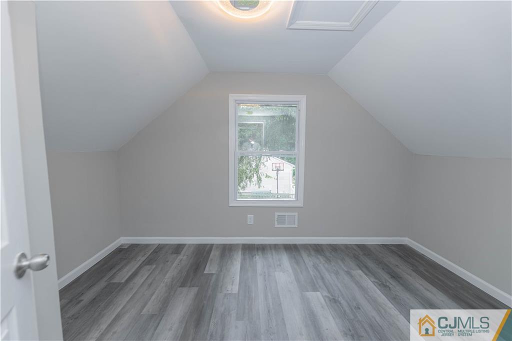 7 North Shore Boulevard Helmetta, NJ 08828 - Photo 30 of 50 a view of an empty room with wooden floor and a window