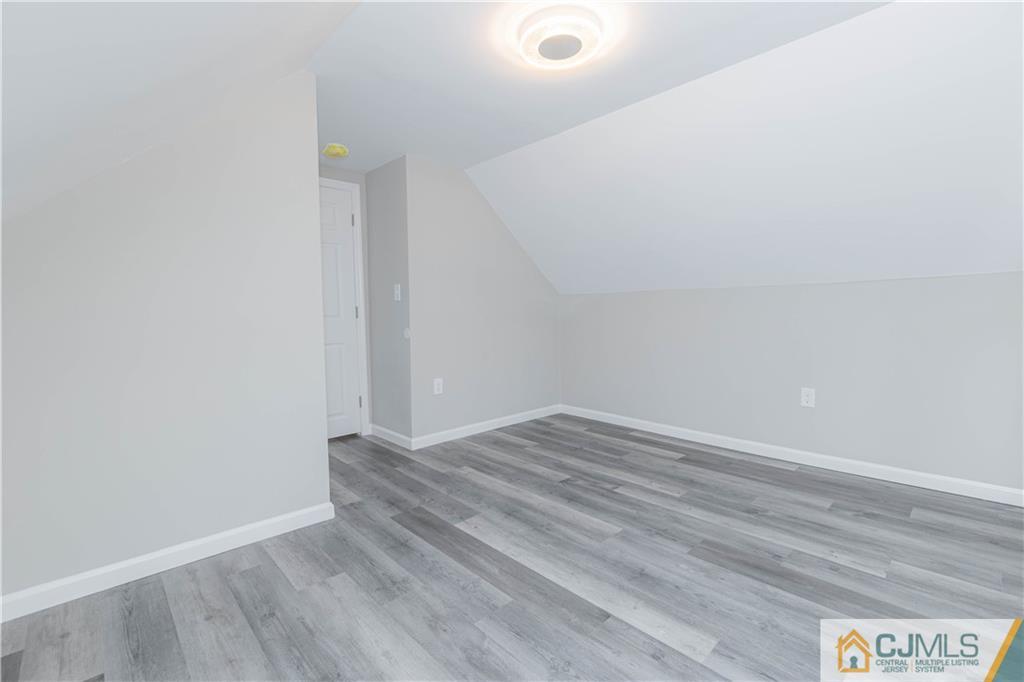 7 North Shore Boulevard Helmetta, NJ 08828 - Photo 31 of 50 a view of an empty room with wooden floor
