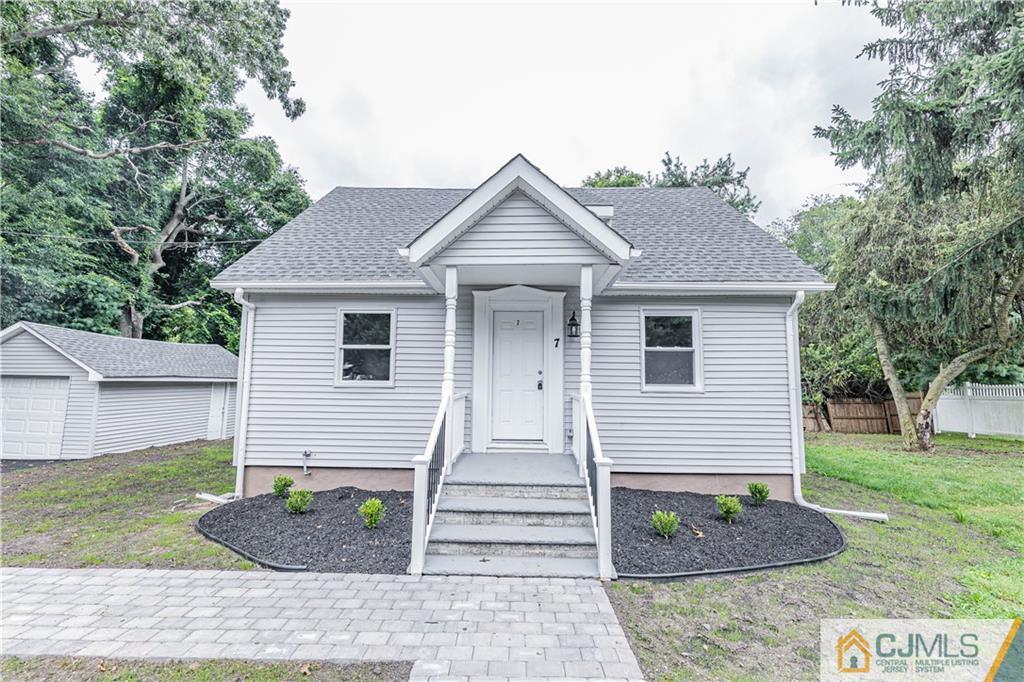 7 North Shore Boulevard Helmetta, NJ 08828 - Photo 45 of 50 a front view of a house with garden