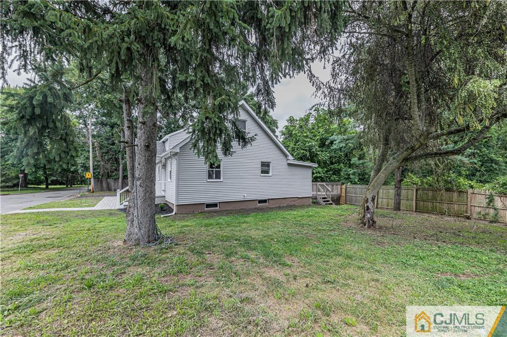 7 North Shore Boulevard Helmetta, NJ 08828 - Photo 49 of 50 a backyard of a house with plants and large tree