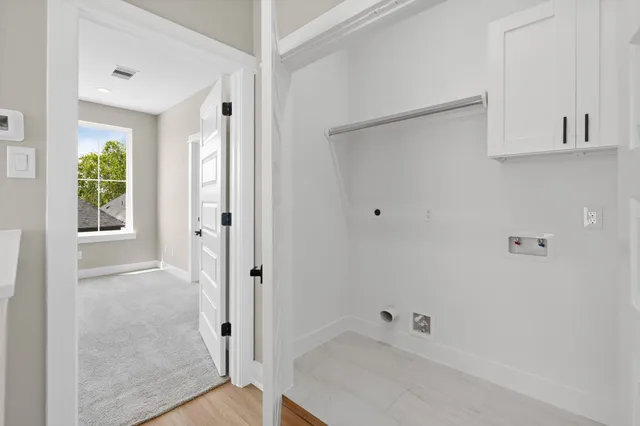 a white bath tub sitting next to a white sink