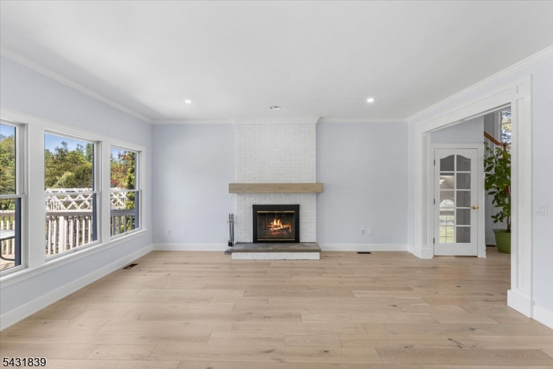 15 Spring Hunter Court Andover, NJ 07821 - Photo 26 of 49 a view of an empty room with a window and fireplace