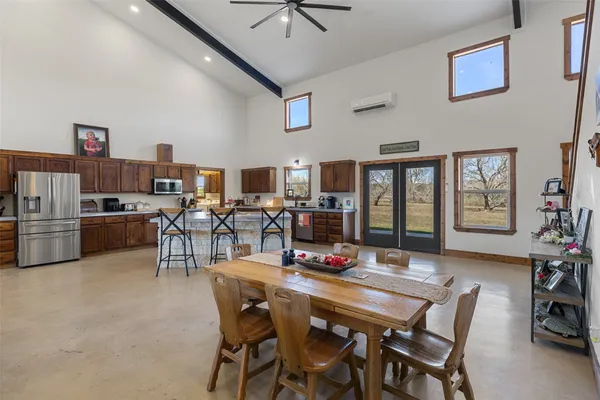 a view of a dining room with furniture and a livingroom