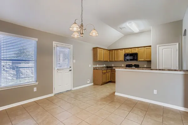 a view of a kitchen with microwave and stove
