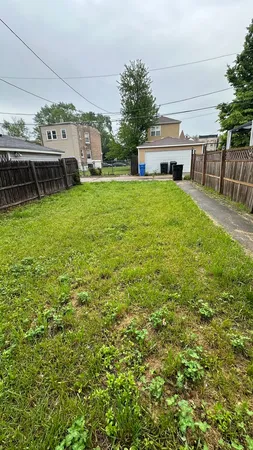 a view of a house with a yard porch and sitting area