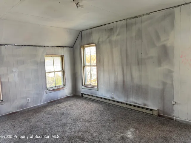 a view of a room that has a window in it