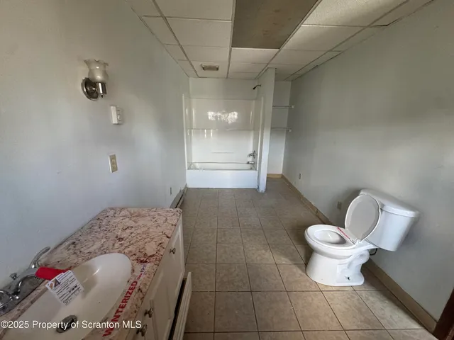 a bathroom with a sink and a toilet