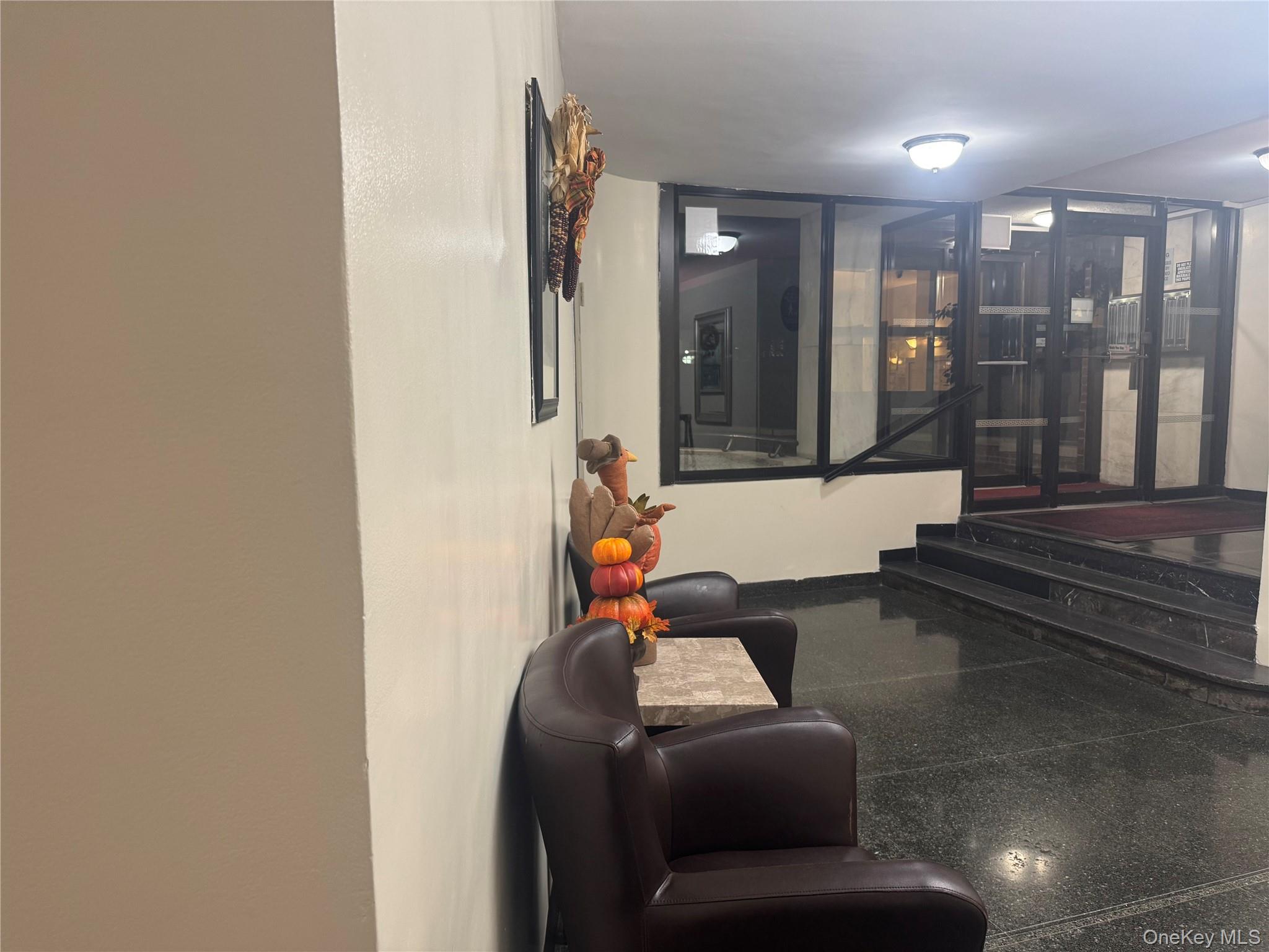 64-34 102nd Street, Unit 7F Queens, NY 11374 - Photo 4 of 17 a living room with furniture and a glass door