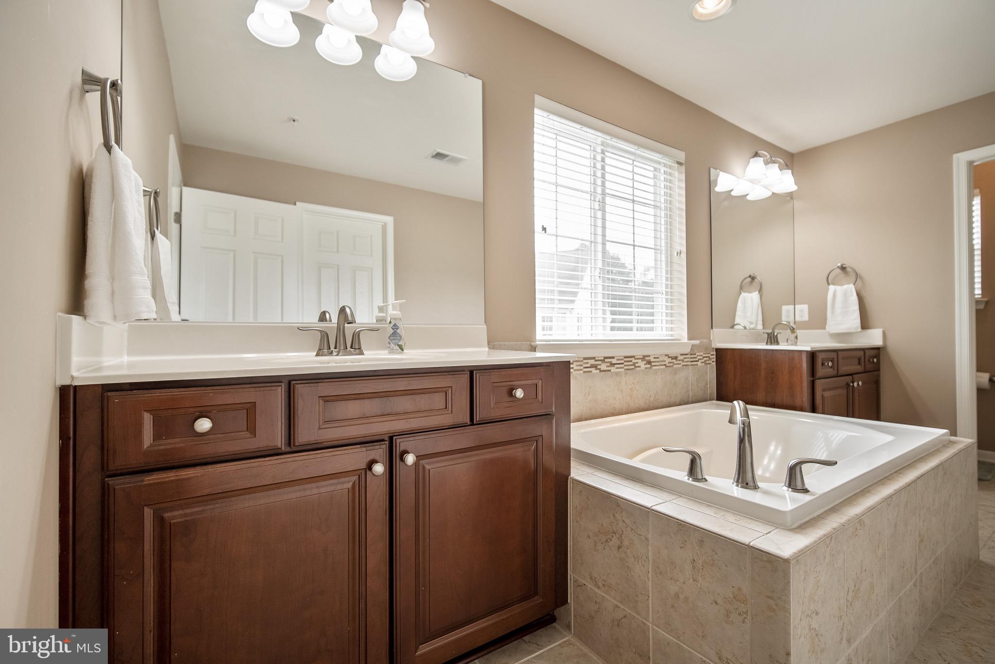 13919 Schaeffer Road Boyds, MD 20841 - Photo 18 of 30 Primary Bath with 2 vanities and a soaking tub