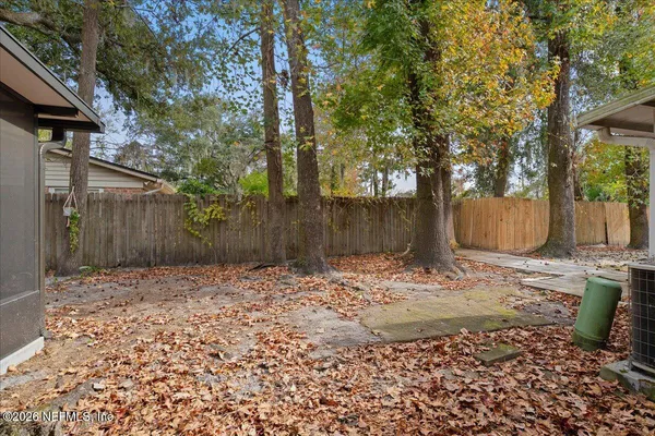 a backyard of a house with lots of green space