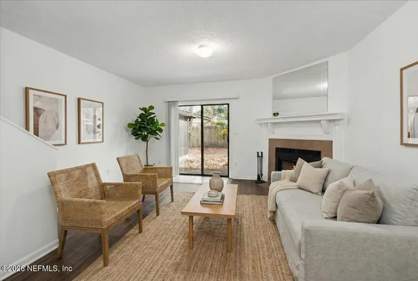 a living room with furniture and a fireplace