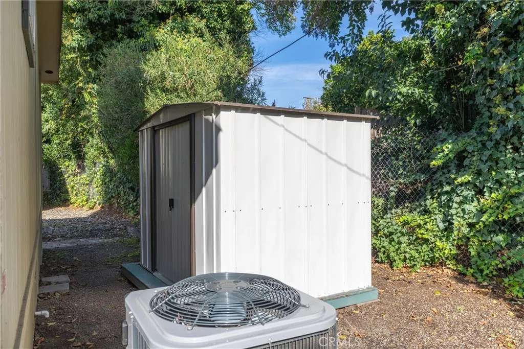 567 East Lassen Avenue, Unit 109 Chico, CA 95928 - Photo 24 of 34 a backyard of a house with a fountain plants and tree