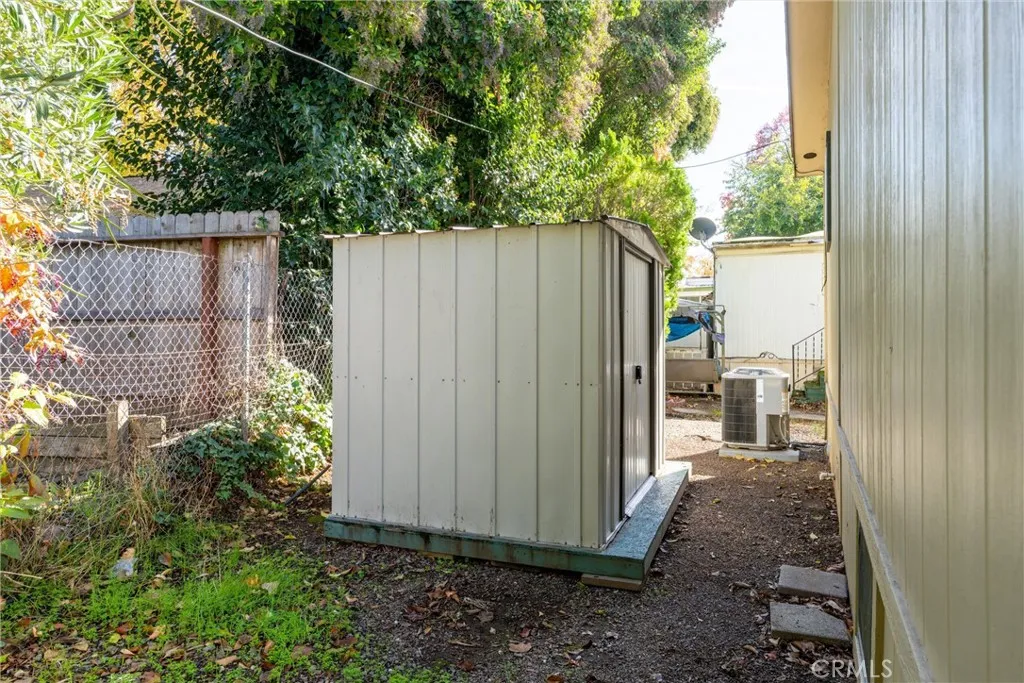 567 East Lassen Avenue, Unit 109 Chico, CA 95928 - Photo 25 of 34 a view of a backyard with plants and wooden fence