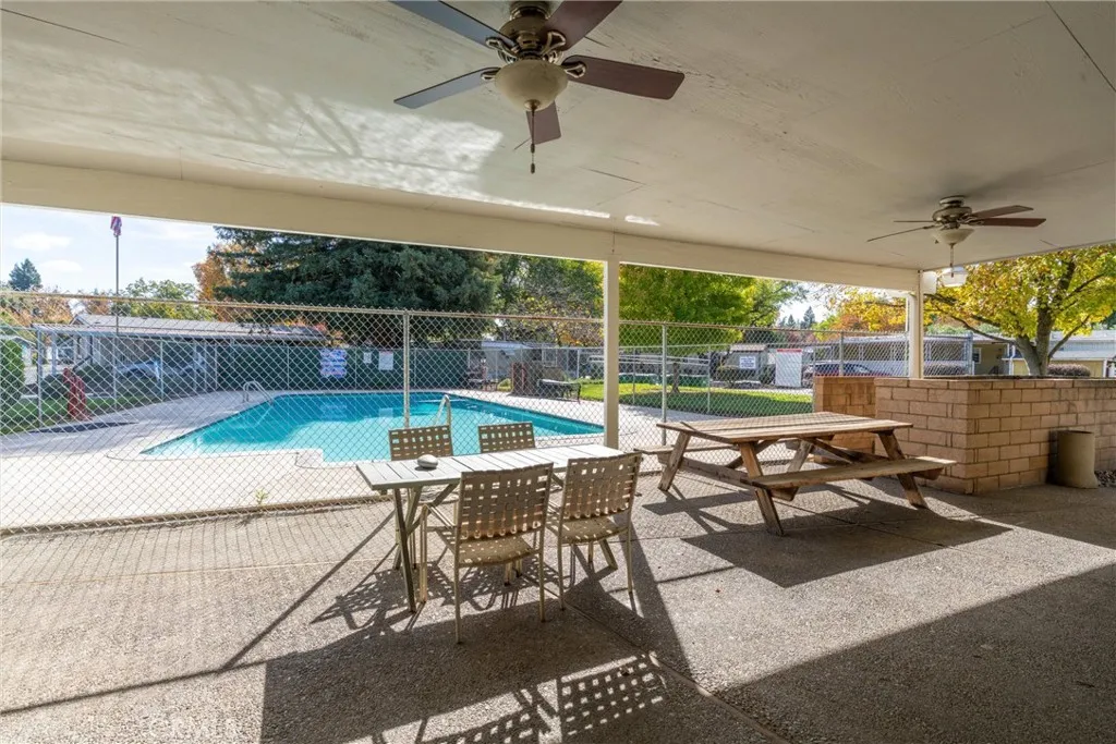 567 East Lassen Avenue, Unit 109 Chico, CA 95928 - Photo 31 of 34 a roof deck with table and chairs and potted plants