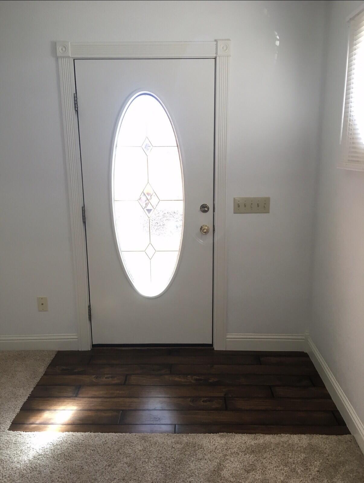 101 Southeast 6th Plainview, TX 79072 - Photo 24 of 31 an empty room with wooden floor and windows