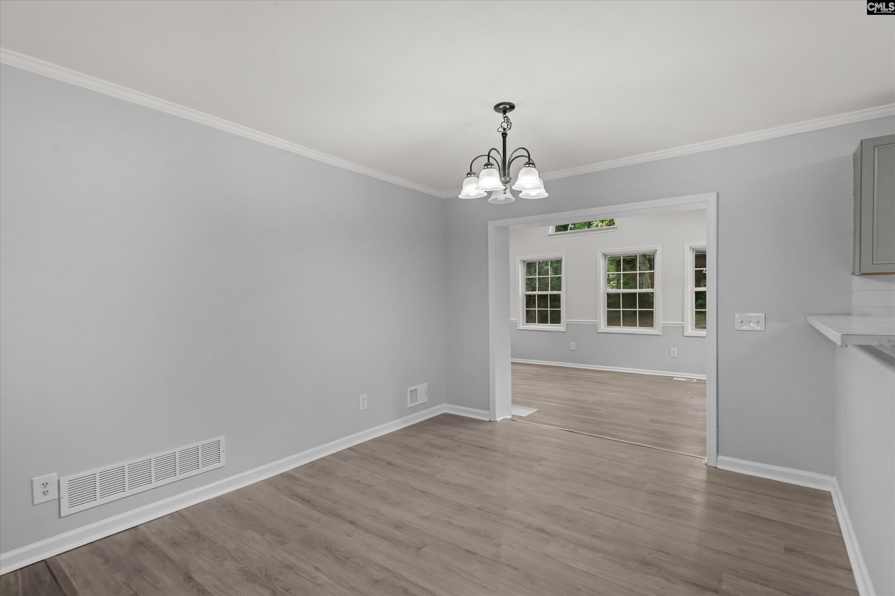 245 Piney Grove Road Columbia, SC 29210 - Photo 11 of 29 wooden floor in an empty room with a window