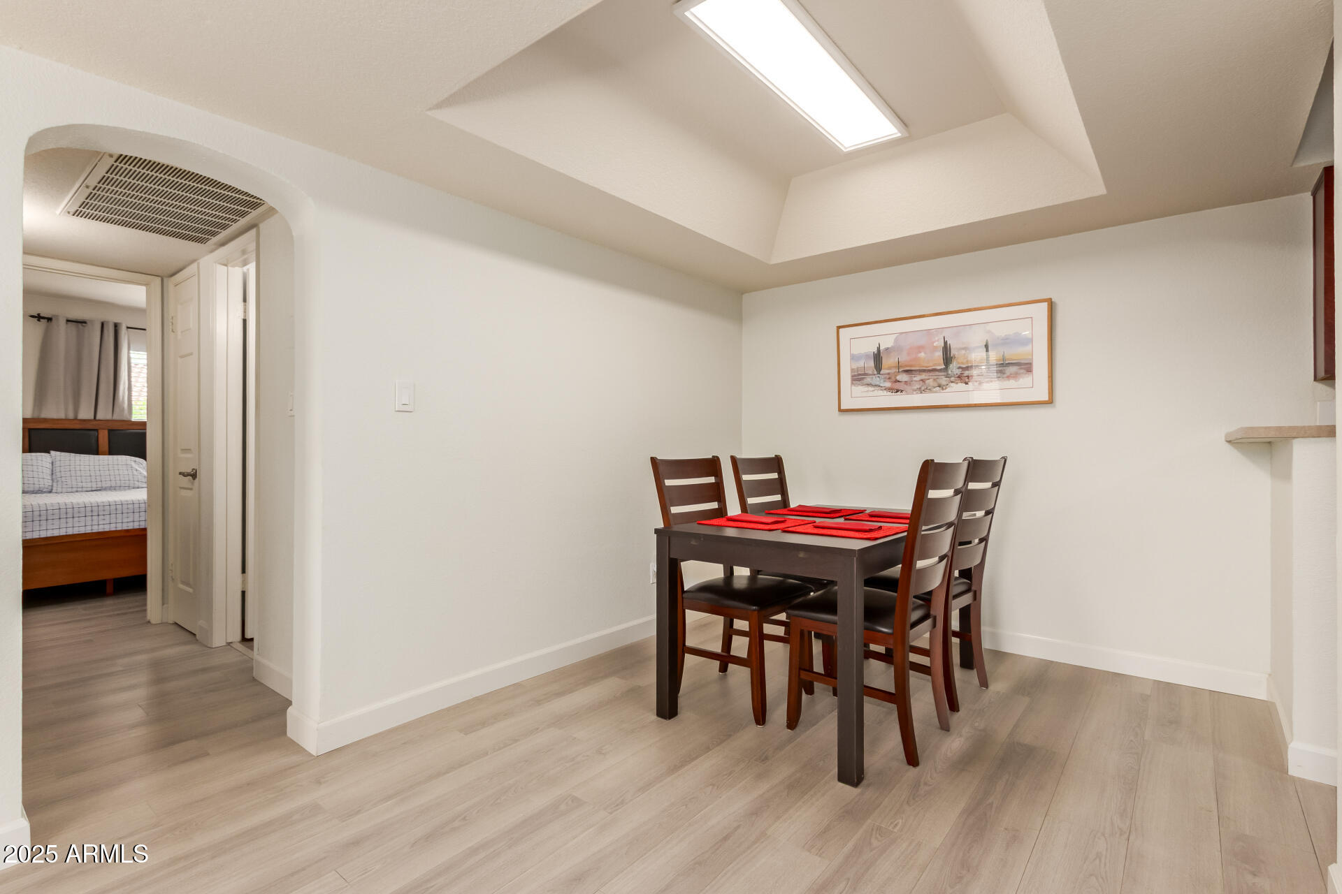 8787 East Mountain View Road, Unit 2015 Scottsdale, AZ 85258 - Photo 12 of 31 a view of a dining room with furniture and wooden floor