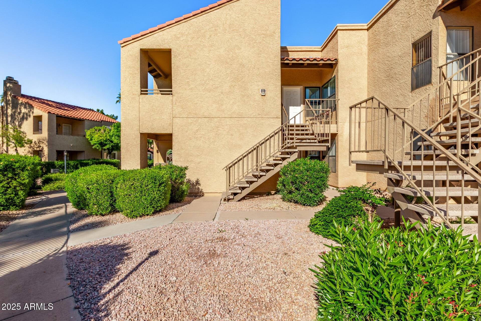 8787 East Mountain View Road, Unit 2015 Scottsdale, AZ 85258 - Photo 2 of 31 a view of a large building with many windows next to a road