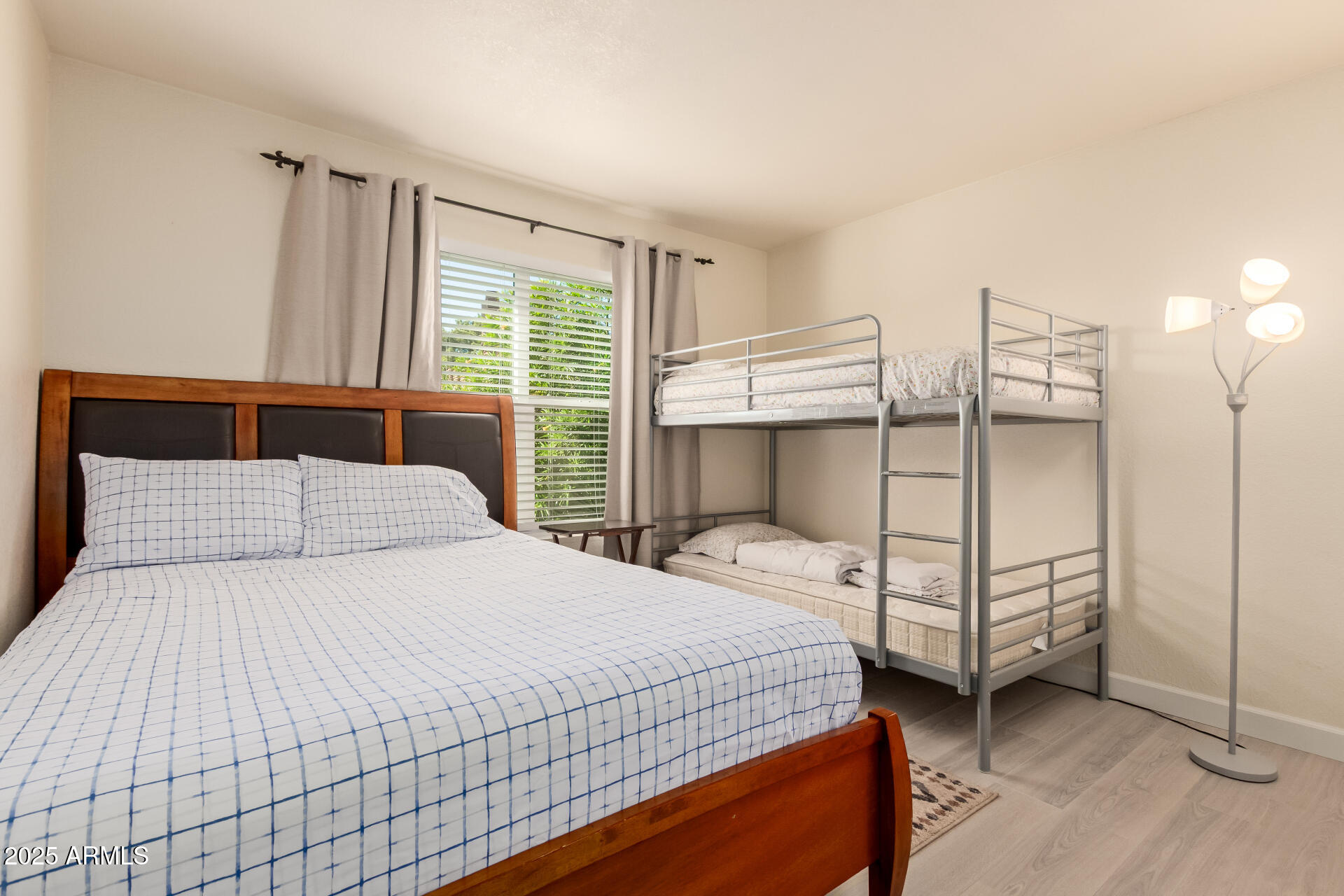 8787 East Mountain View Road, Unit 2015 Scottsdale, AZ 85258 - Photo 22 of 31 a bedroom with a bed and a window