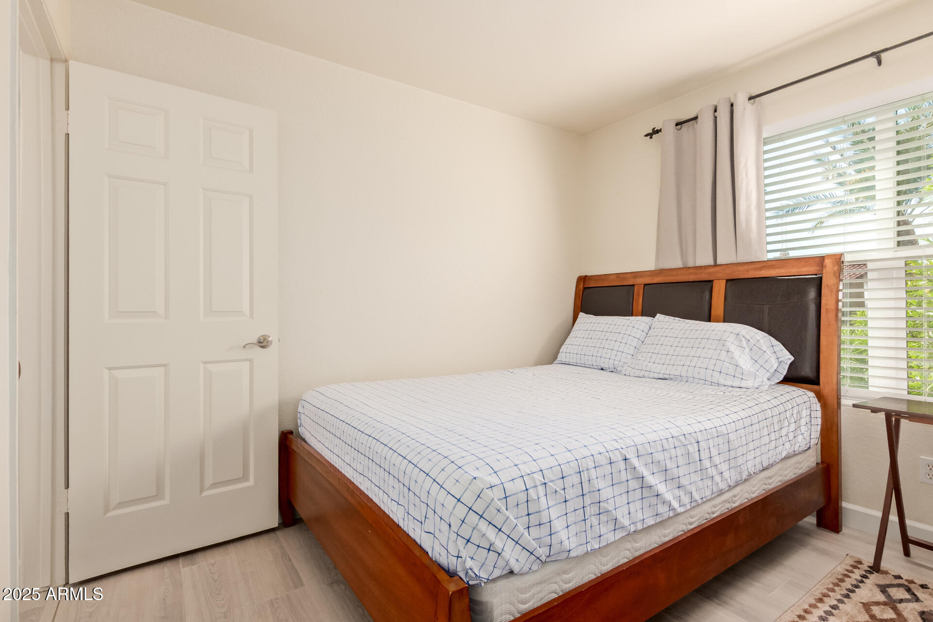 8787 East Mountain View Road, Unit 2015 Scottsdale, AZ 85258 - Photo 23 of 31 a bedroom with a bed and window