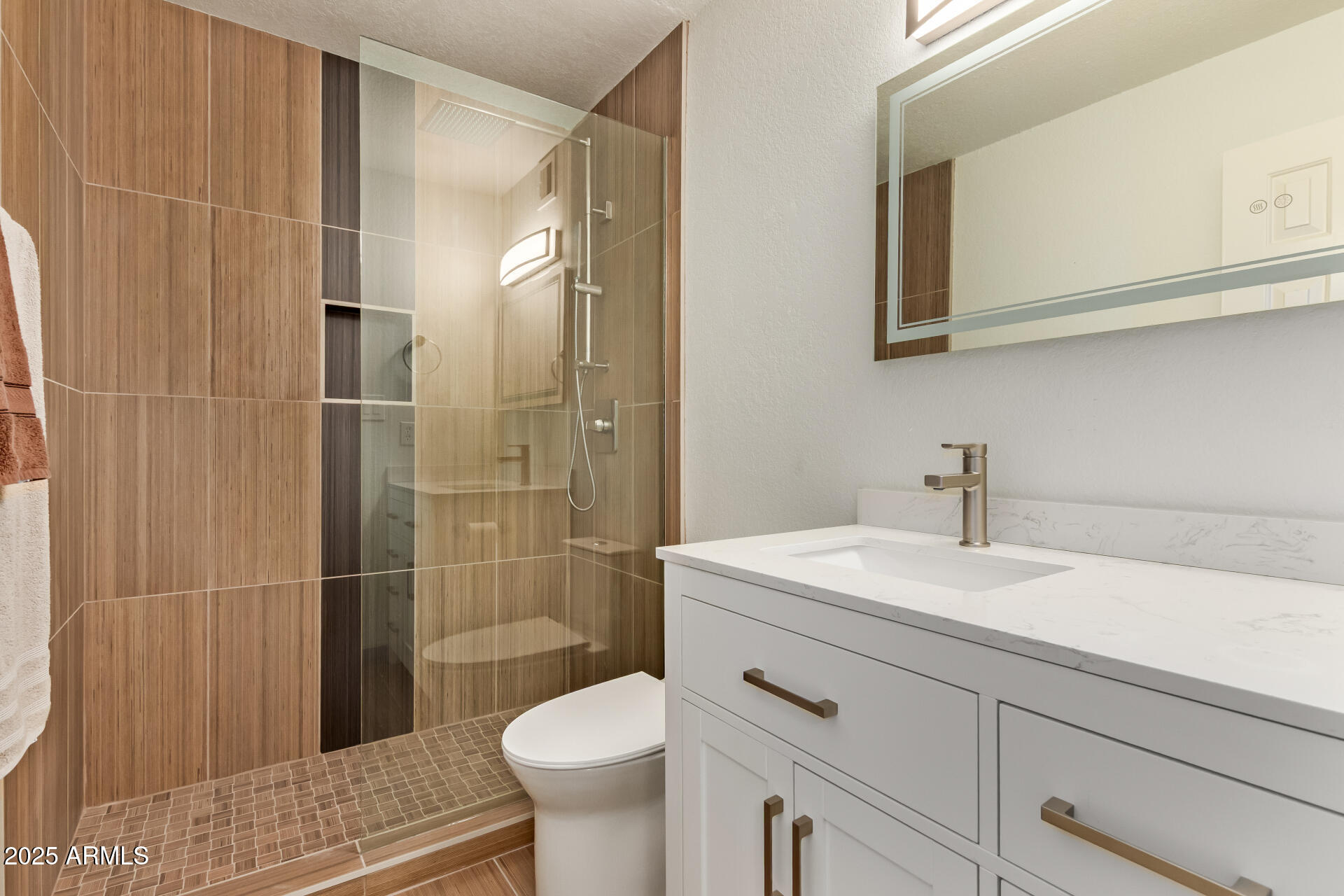 8787 East Mountain View Road, Unit 2015 Scottsdale, AZ 85258 - Photo 24 of 31 a bathroom with a sink a toilet and shower