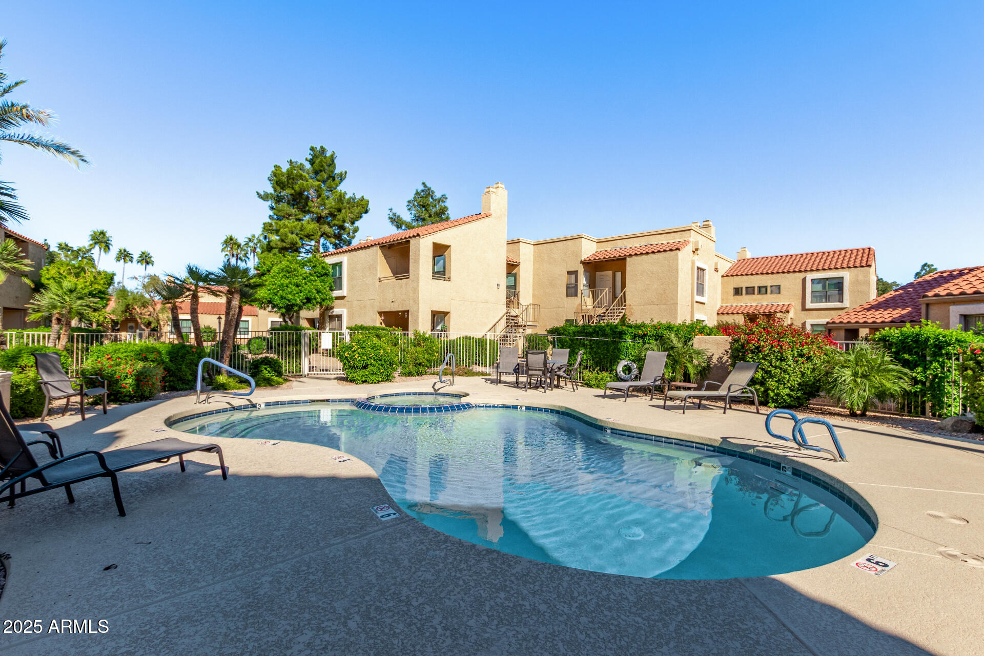 8787 East Mountain View Road, Unit 2015 Scottsdale, AZ 85258 - Photo 27 of 31 a view of a house with swimming pool and sitting area