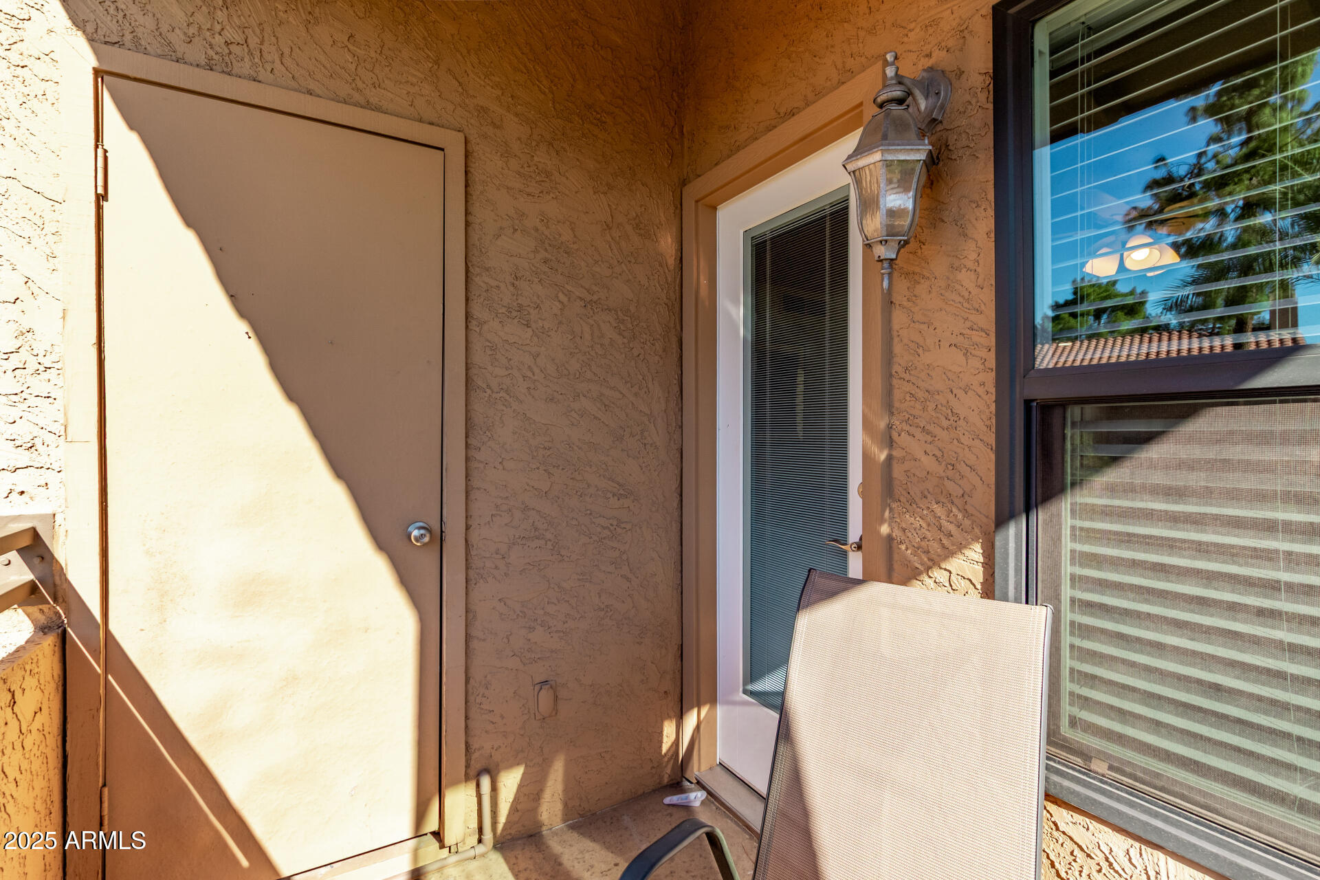 8787 East Mountain View Road, Unit 2015 Scottsdale, AZ 85258 - Photo 31 of 31 a view of a balcony with chair and front door