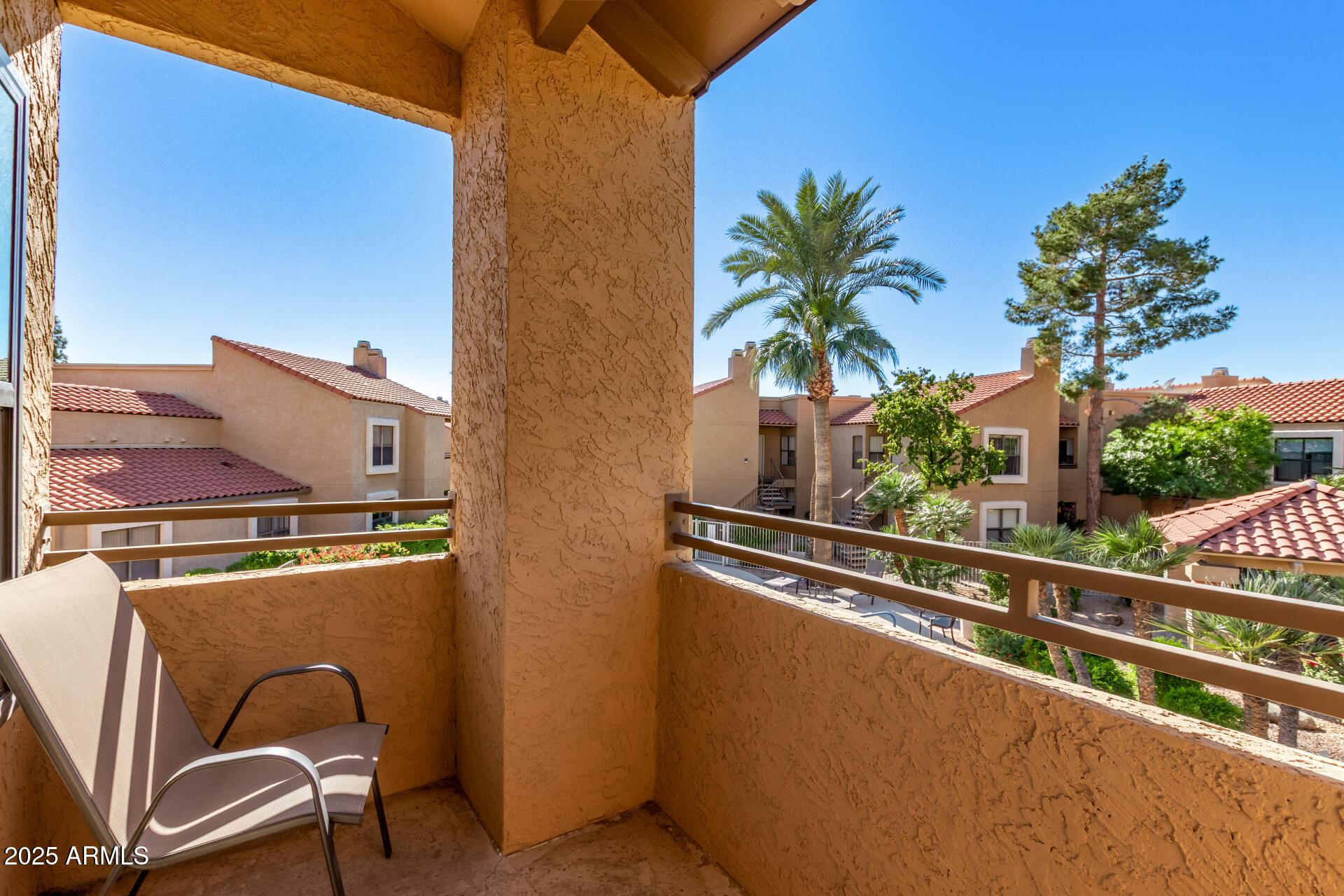 8787 East Mountain View Road, Unit 2015 Scottsdale, AZ 85258 - Photo 5 of 31 a view of a balcony with chairs