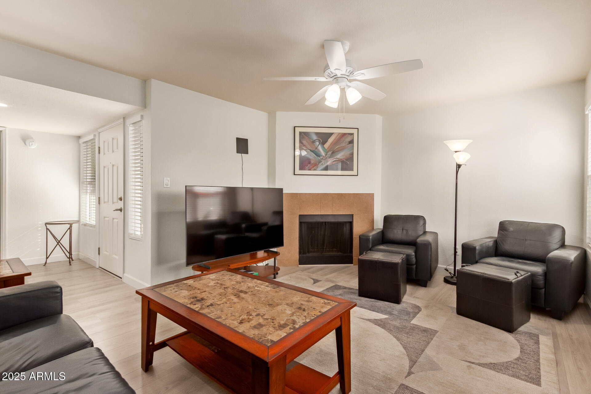 8787 East Mountain View Road, Unit 2015 Scottsdale, AZ 85258 - Photo 9 of 31 a living room with furniture a flat screen tv and kitchen view