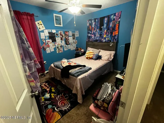 a bed room with a bed and a couch