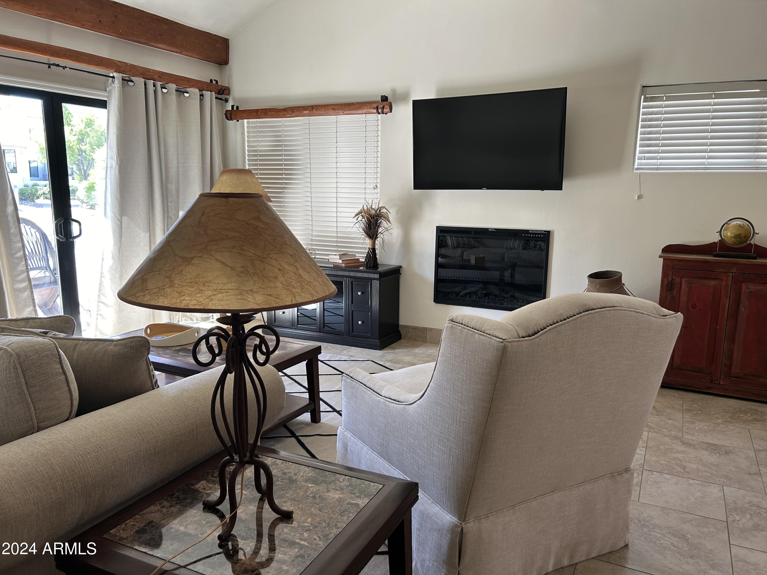 7272 East Gainey Ranch Road, Unit 124 Scottsdale, AZ 85258 - Photo 3 of 36 LIVING ROOM W REMOTE FIREPLACE