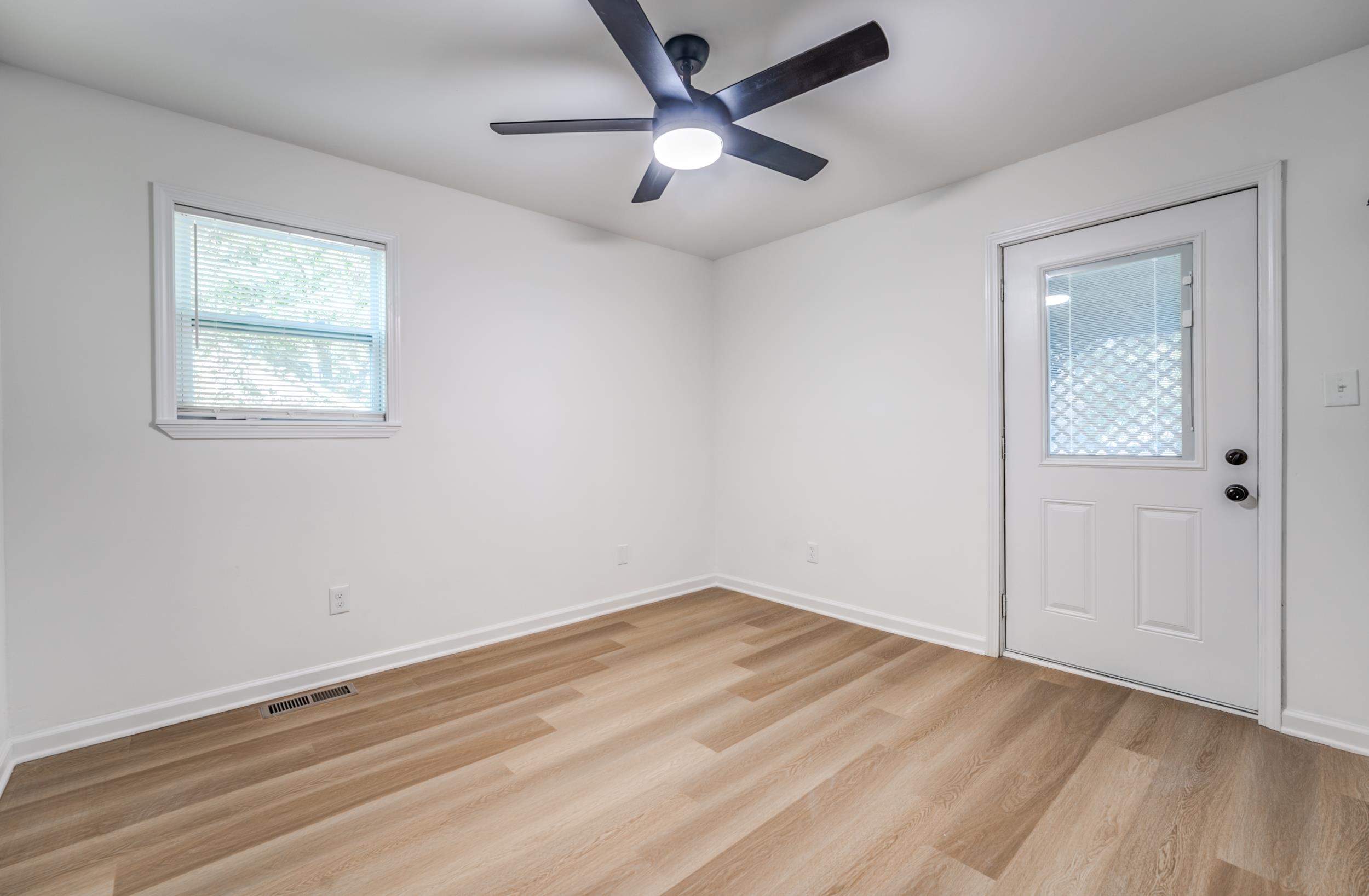 3994 Oak Road Bartlett, TN 38135 - Photo 10 of 10 wooden floor in an empty room with a window