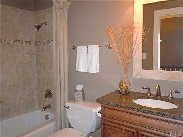 1305 Lions Way Raleigh, NC 27604 - Photo 17 of 25 WHAT A PRETTY HALL BATH ! GRANITE + TILE SHOWER / TUB AND TILE FLOOR Bathroom