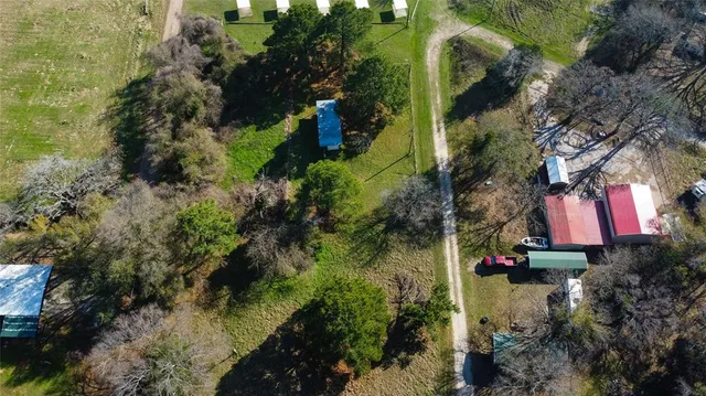 an aerial view of residential house with outdoor space