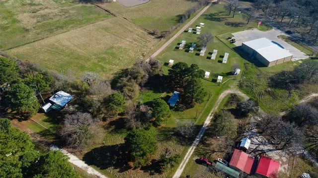an aerial view of residential houses with outdoor space