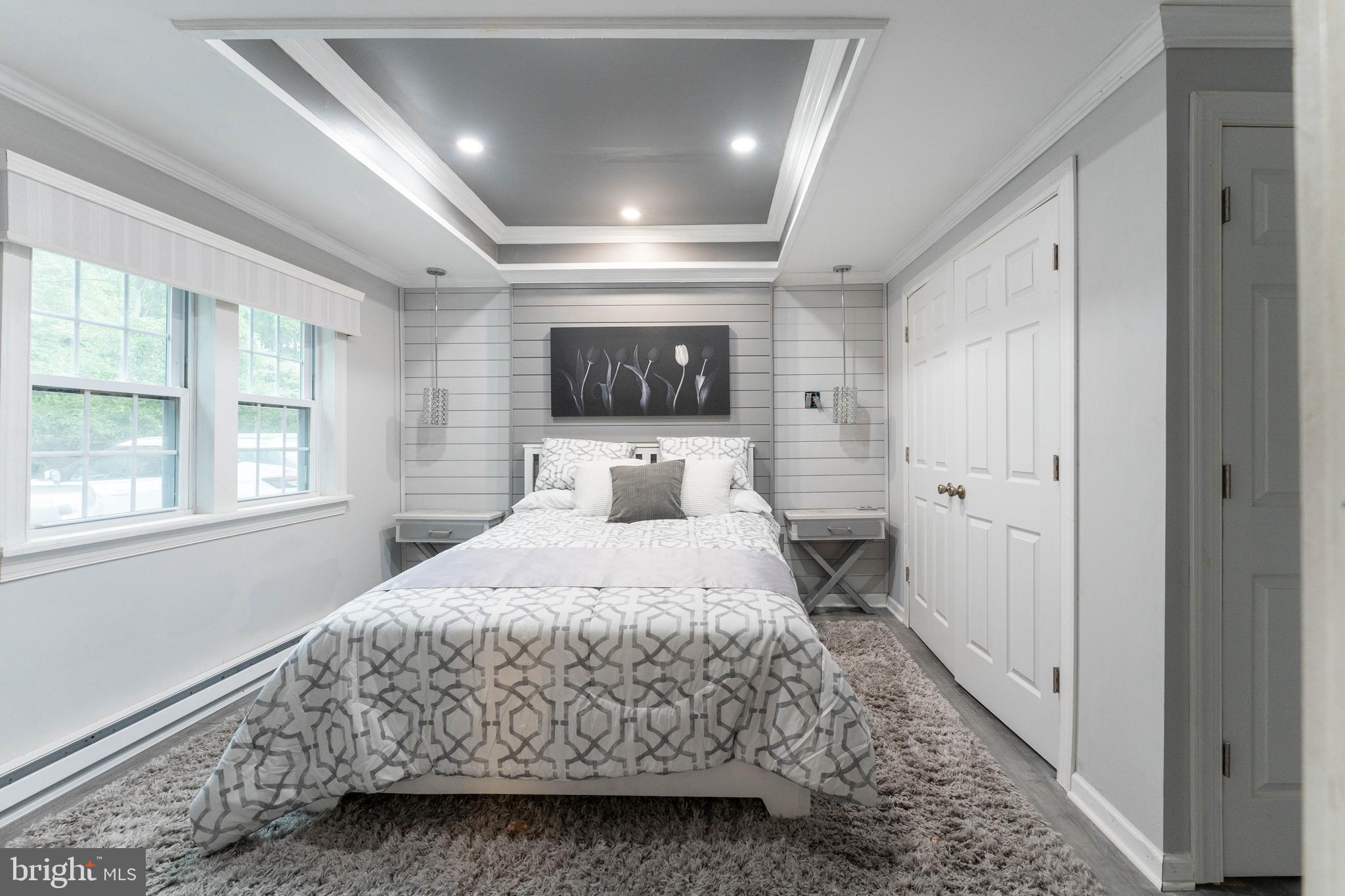 2941 Pheasant Run Road Norristown, PA 19403 - Photo 17 of 23 a bedroom with a bed and a large window