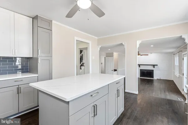 a kitchen with a stove a sink and a refrigerator