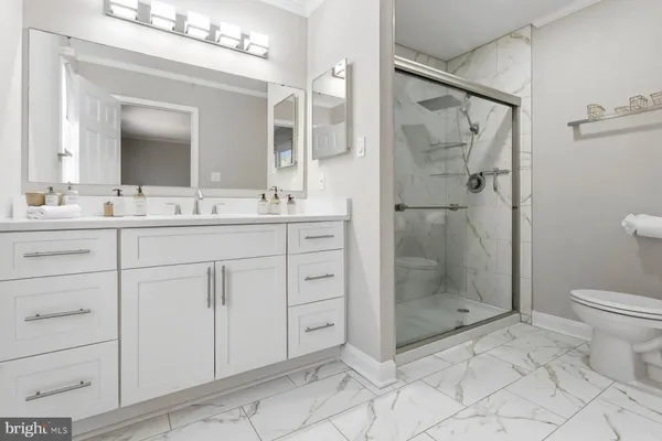 a bathroom with a shower and toilet